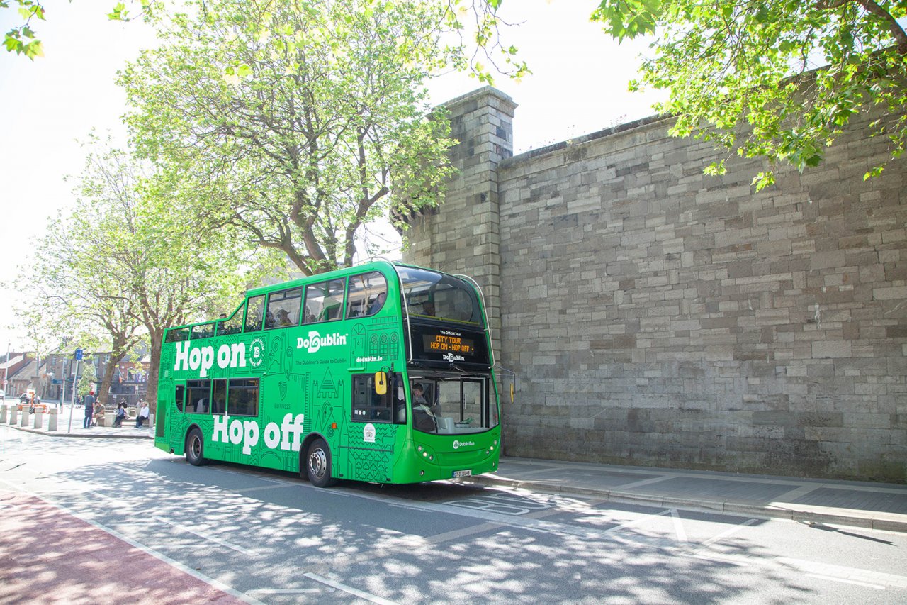 open top bus outside castle