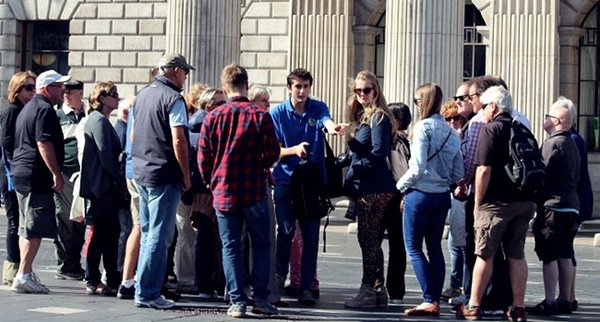 walking tour guide with customers